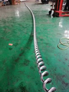 custom screw flight fabrication for industrial conveyor systems